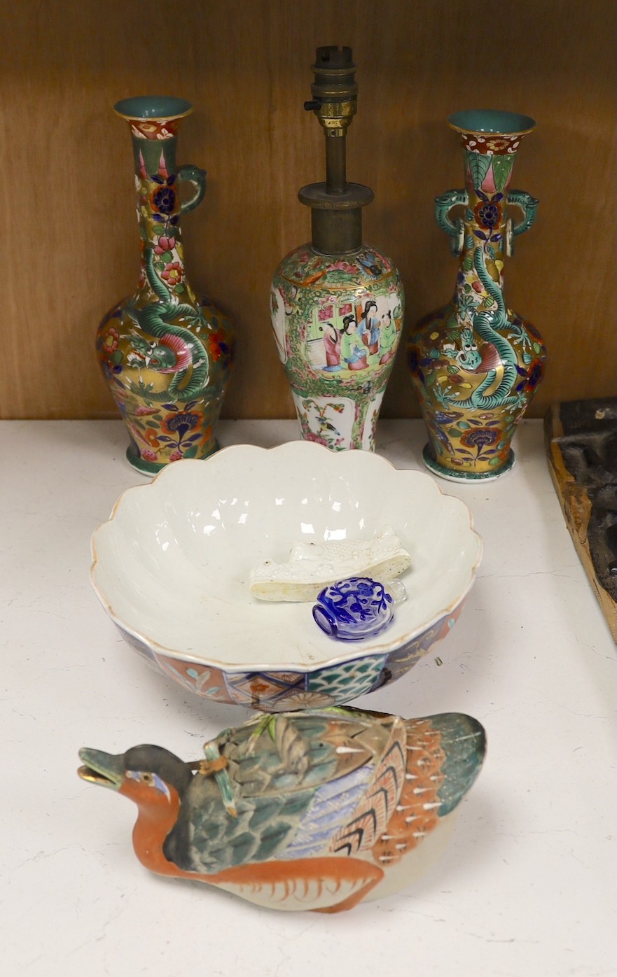 A Chinese overlaid glass snuff bottle, together with a Chinese famille rose vase converted into a lamp, together with, a fish brush holder, a Japanese painted ceramic duck, and other items, tallest 29cm